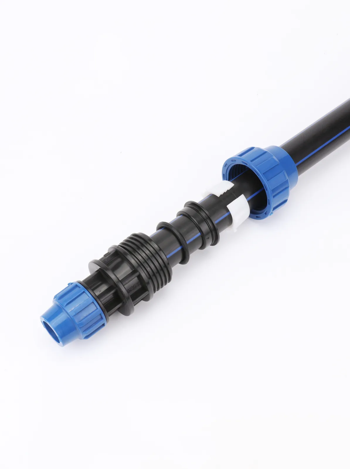Black HDPE pipe joined with blue PP compression fittings