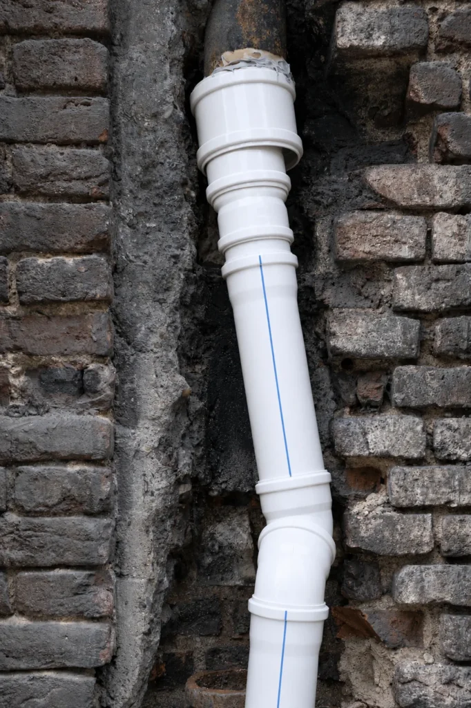 White UPVC drainage pipe stack, illustrative placeholder