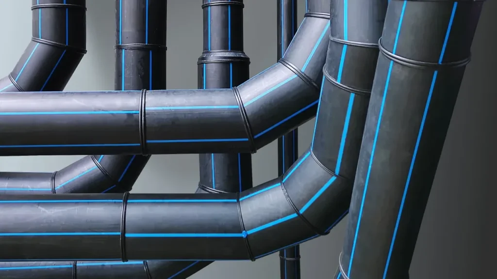 Butt-fused black HDPE mains pipework with blue potable stripes, elbows and straight runs joined face to face
